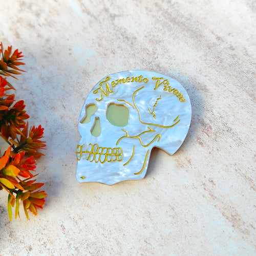 'Memento Vivere' skull brooch